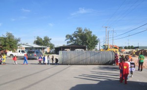 School children walking through the 60-in storm drain pipe